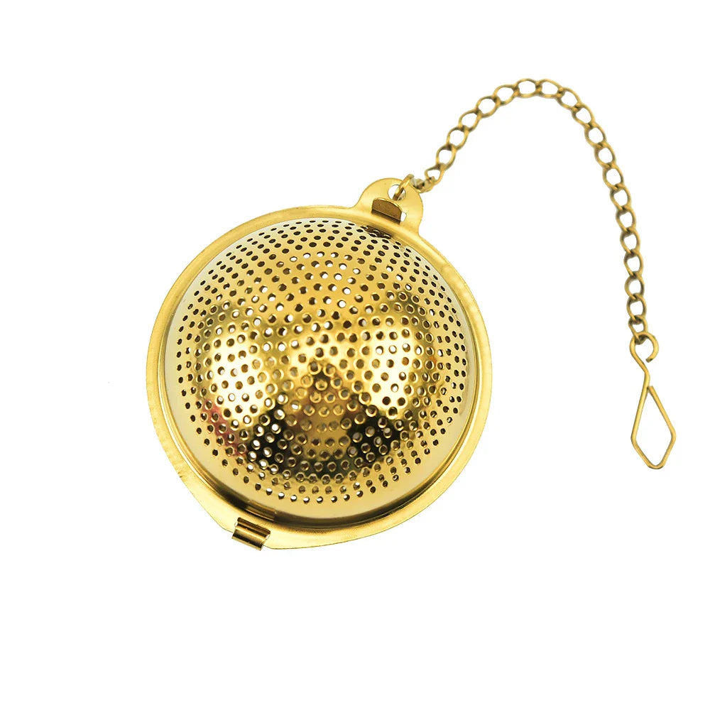 Gold pendant tea infuser with stainless steel construction and an elegant, modern design