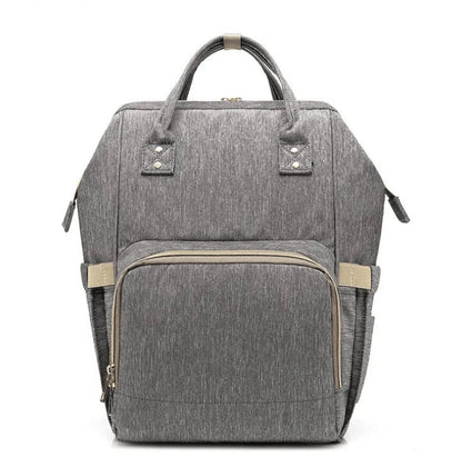 Stylish and practical mummy bag with reinforced handles, durable buckles, and separate bottling area for Kiwi mums