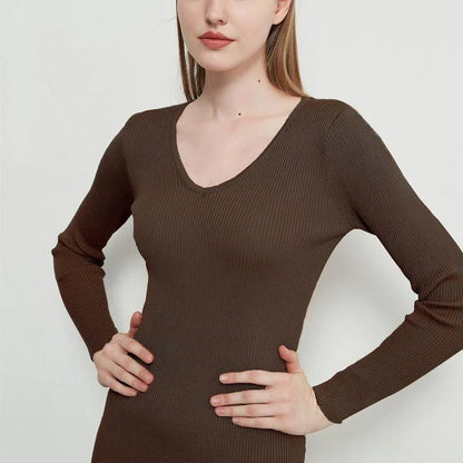 A chic and elegant knitted midi dress in neutral tones, featuring a graceful V-neck, full-length sleeves, and a flattering body-hugging silhouette.