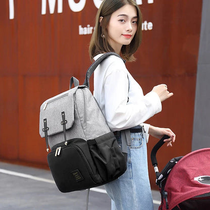 Versatile Mummy Daddy Backpack in Grey, a functional and stylish nappy bag for Kiwi families with a spacious main compartment, insulated pockets, and a USB charging port.