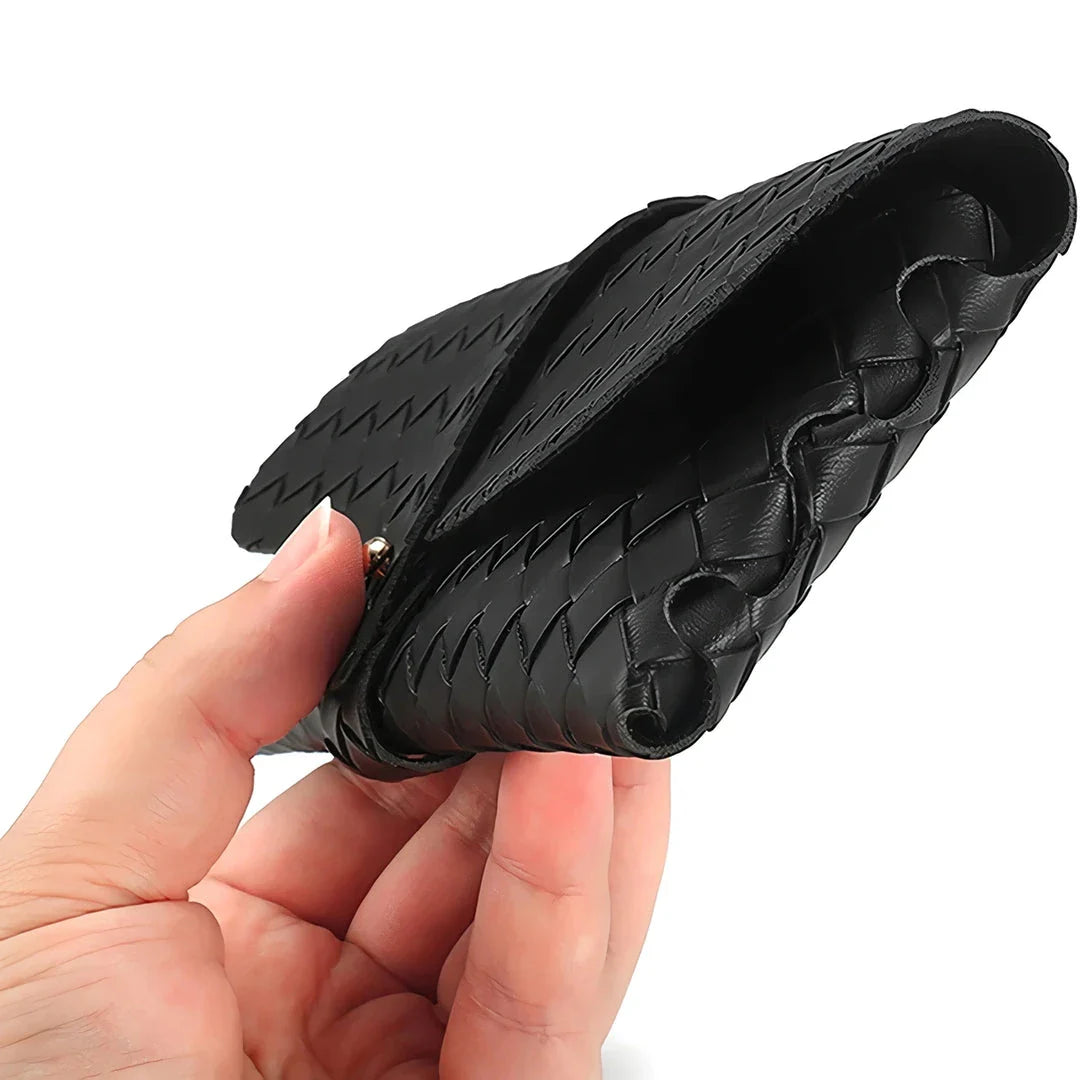 Stylish black and white twist braided leather sunglasses case with snap closure, protecting eyewear in a fashionable way