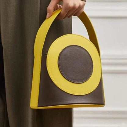 Stylish vegan leather colour block bucket bag with adjustable strap, perfect for modern Kiwi lifestyles