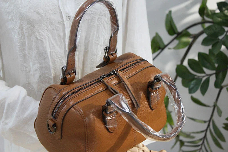 Classic leather shoulder bag in brown with a soft, pillowy shape and cotton lining for ultimate comfort and style