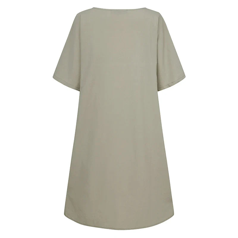 A cotton and linen dress with a round neckline, pockets, and an A-line silhouette in various colors.