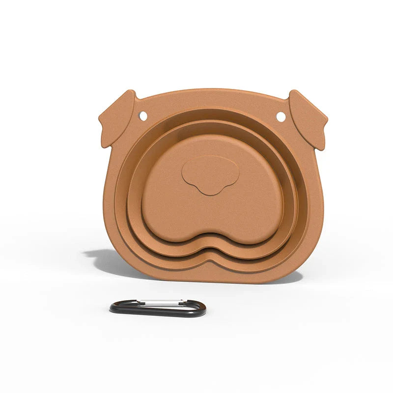 Collapsible dog bowls made of durable silicone with a paw print design, ideal for outdoor adventures with your Kiwi pup