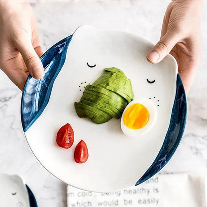 A charming ceramic plate featuring a vibrant cartoon animal pattern, perfect for adding a touch of Kiwi-inspired style to your dining table.