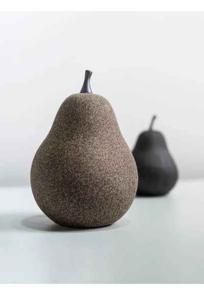 Handcrafted ceramic pear decoration with a sleek, modern design, perfect for adding a touch of natural elegance to any Kiwi home