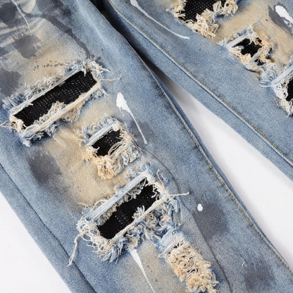 Vintage-inspired jeans with rhinestone and ink splash detailing, perfect for the modern Kiwi lifestyle