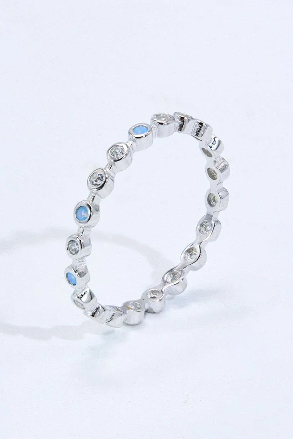 Moonstone and zircon ring with 925 sterling silver and platinum plating, showcasing the natural beauty of Aotearoa