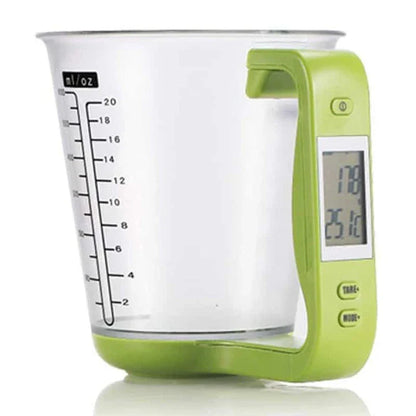 A green digital measuring cup with an LCD display integrated into the handle, designed in New Zealand for precise kitchen measurements