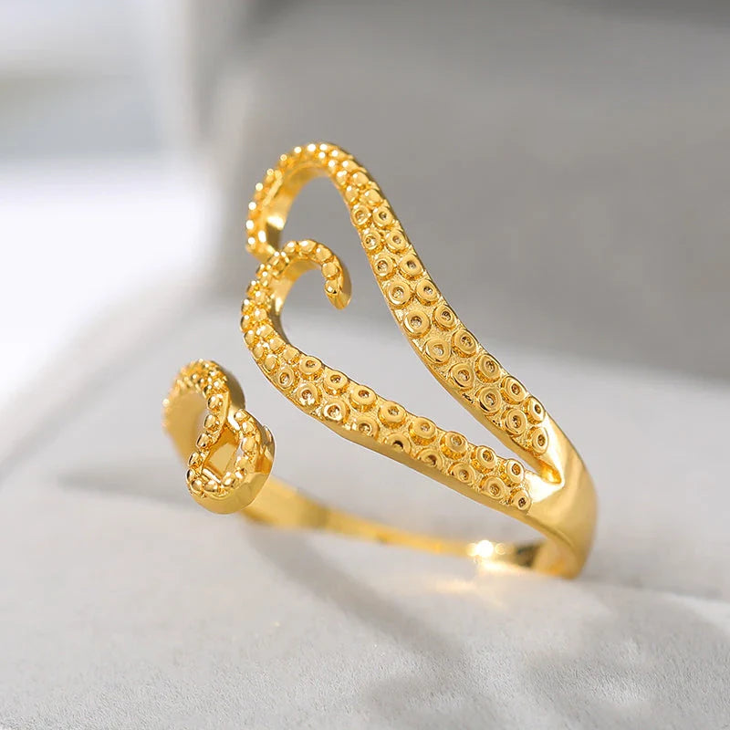 Adjustable octopus tentacle wrap ring in gold, a unique and versatile accessory for Kiwis