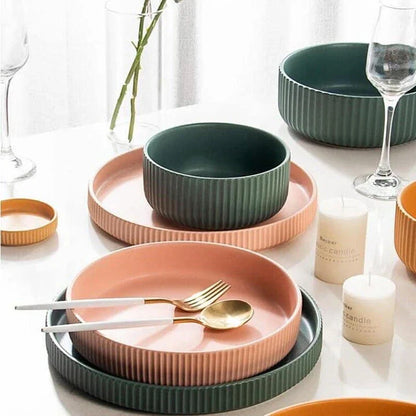 Stylish assorted candy-colored ribbed ceramic tableware set including plates and bowls, made in New Zealand with eco-friendly materials