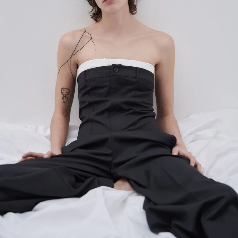 A stylish sea blue jumpsuit with contrast stitching and wide legs, a perfect combination of fashion and function.