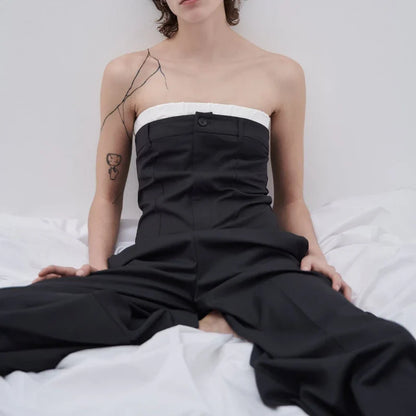 A stylish sea blue jumpsuit with contrast stitching and wide legs, a perfect combination of fashion and function.