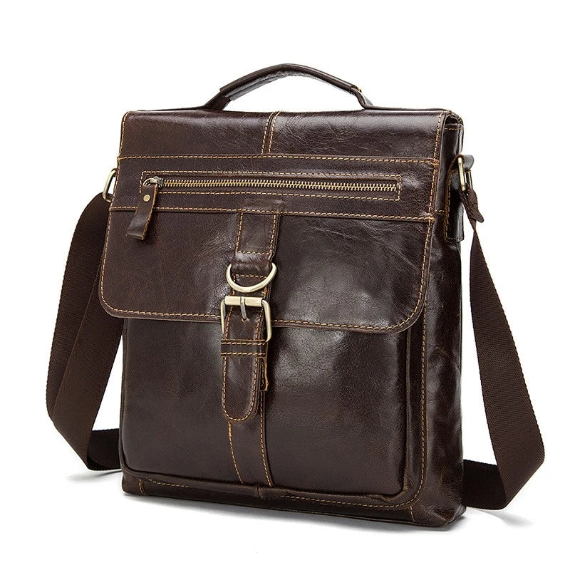 Vintage one-shoulder leather satchel made with premium New Zealand cowhide, featuring a sleek square design, multiple interior pockets, and a comfortable single strap for hands-free convenience.