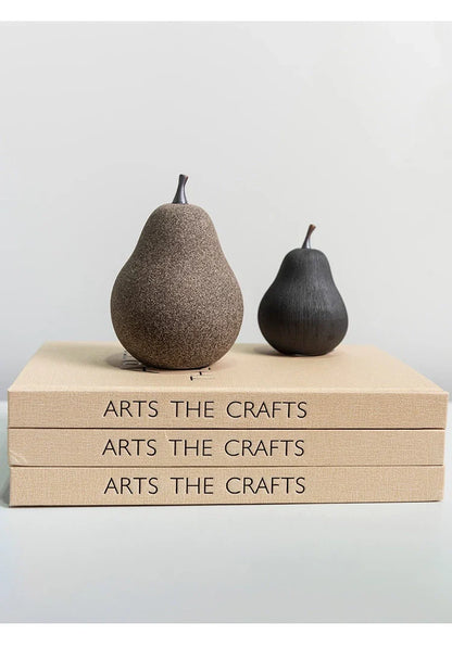 Handcrafted ceramic pear decoration with a sleek, modern design, perfect for adding a touch of natural elegance to any Kiwi home