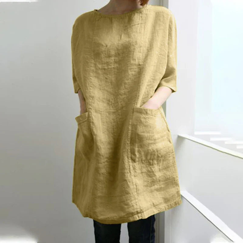 A cotton and linen dress with a round neckline, pockets, and an A-line silhouette in various colors.