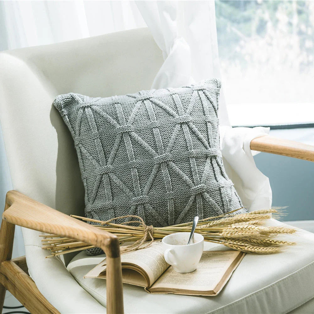 Elegant grey knitted decorative pillow case with intricate jacquard pattern and embroidered stripes