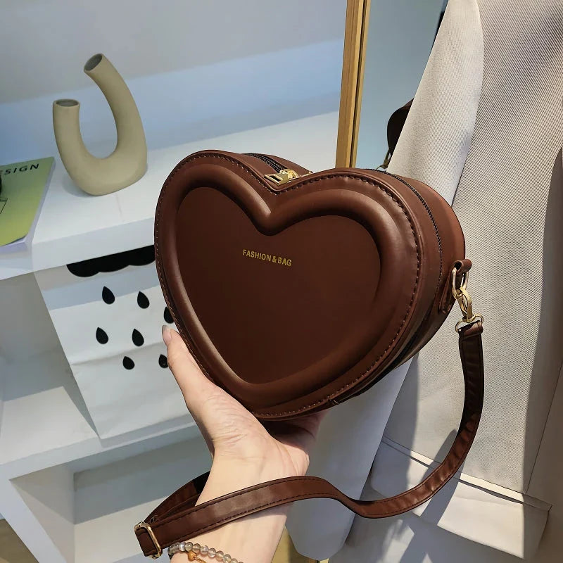 Stylish heart-shaped crossbody bag made from premium PU leather, available in multiple colours for the modern Kiwi woman