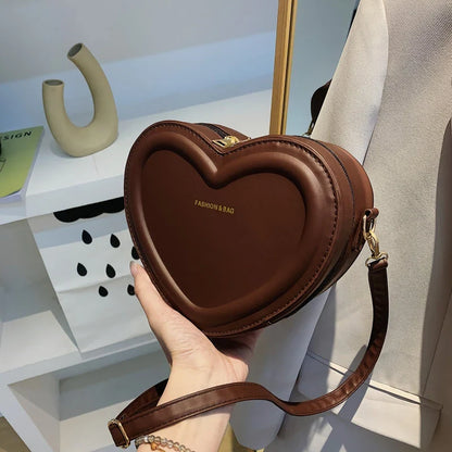 Stylish heart-shaped crossbody bag made from premium PU leather, available in multiple colours for the modern Kiwi woman