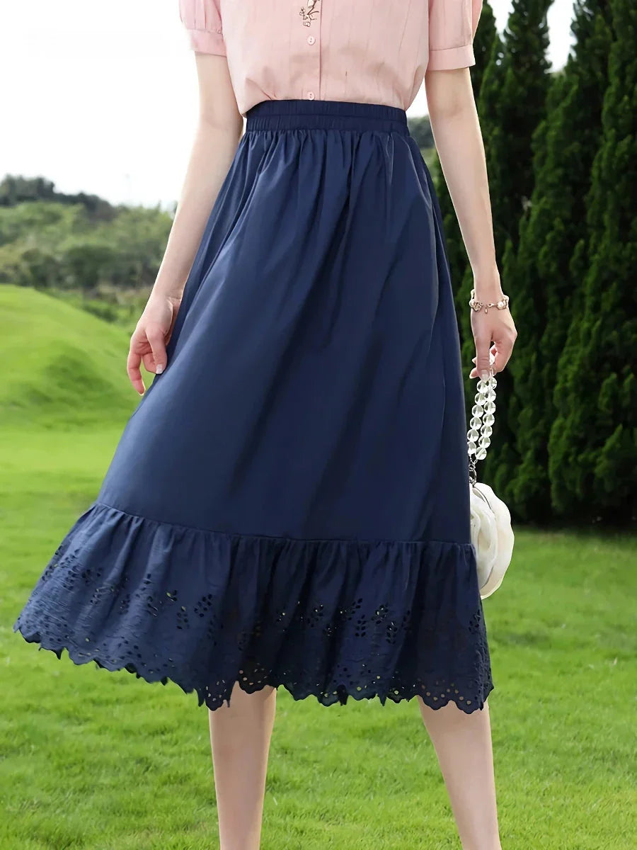 Blue high-waisted A-line cotton lace summer skirt with intricate patchwork details and a flattering silhouette