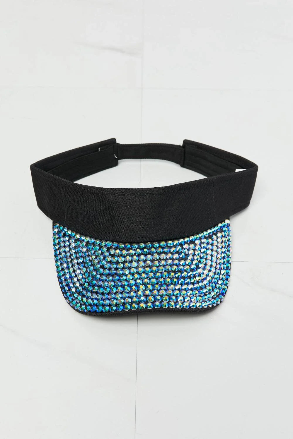 A classic black visor hat with a multi-coloured rhinestone trim, providing sun protection and fashionable style.