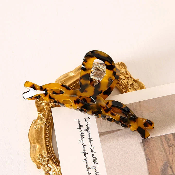 Elegant leopard print hair clip with large weave design, a stylish accessory for Kiwi girls