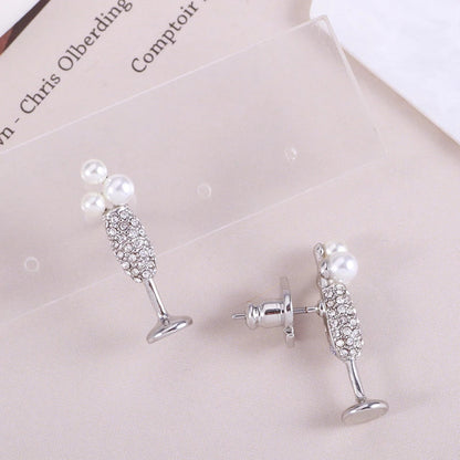 Stunning silver-plated earrings featuring a pearl inlay design, perfect for adding a touch of elegance to any outfit.