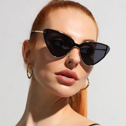 Stylish metal cat-eye sunglasses with premium alloy frames and polycarbonate lenses, offering UV400 protection and a trendy, fashionable look for the discerning Kiwi consumer.