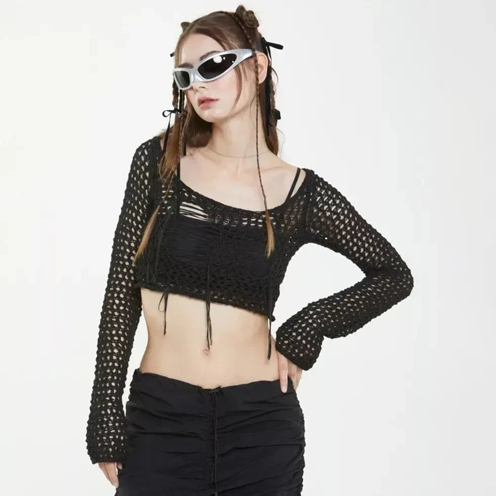 A stylish knitted sweater with hollow-out detailing and tassels, perfect for Kiwi autumn fashion