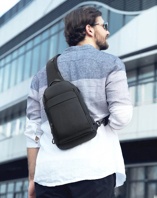 A black, water-resistant crossbody chest bag made from durable Oxford fabric, perfect for everyday use in New Zealand.