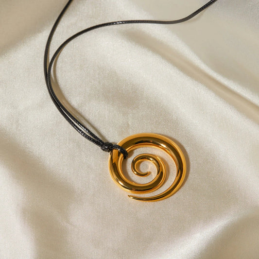 Elegant spiral circle pendant necklace in gold with black rope, a timeless accessory for Kiwi fashionistas