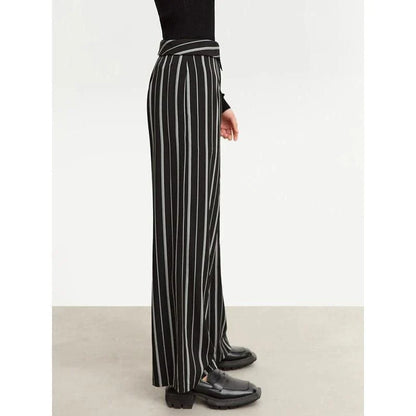 Elegant autumn wide-leg striped trousers for women in a classic black and white pattern