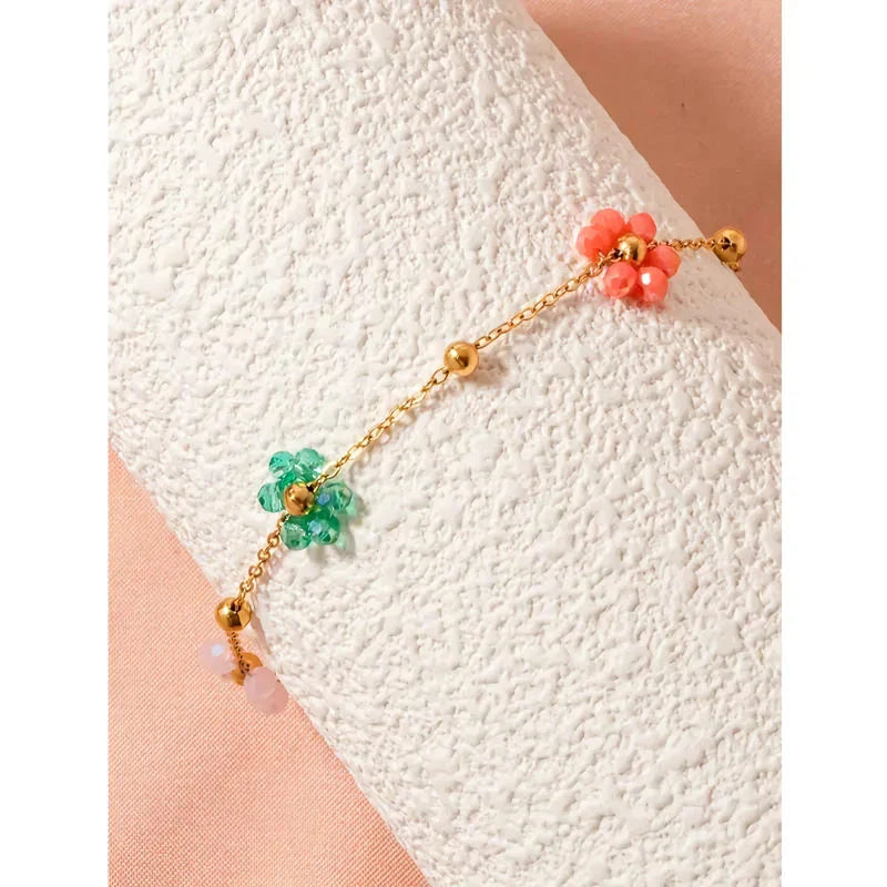 Vibrant, colorful flower-beaded stainless steel bracelet with adjustable chain and link design