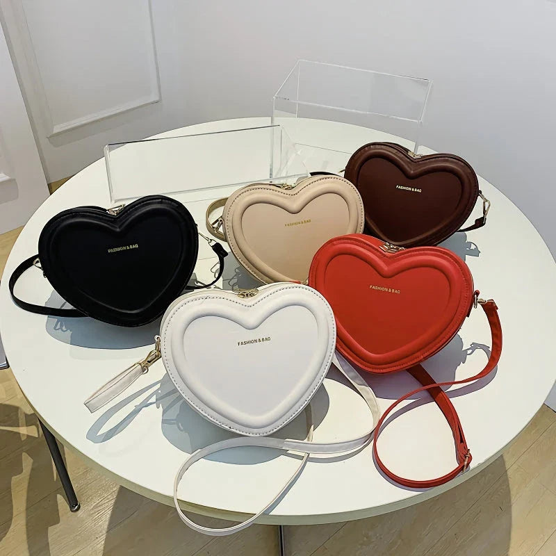 Stylish heart-shaped crossbody bag made from premium PU leather, available in multiple colours for the modern Kiwi woman