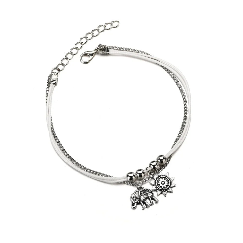 Bohemian-style anklet with star and elephant pendant charms, made from durable zinc alloy in shimmering silver and gold tones