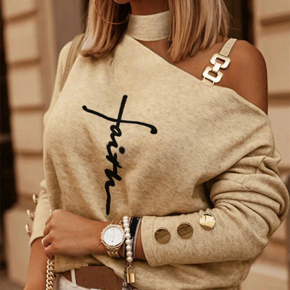 Stylish diagonal shoulder chain embellished long sleeve top in black, perfect for casual Kiwi-inspired fashion