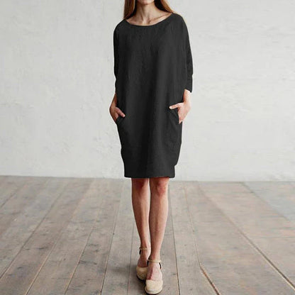 A cotton and linen dress with a round neckline, pockets, and an A-line silhouette in various colors.