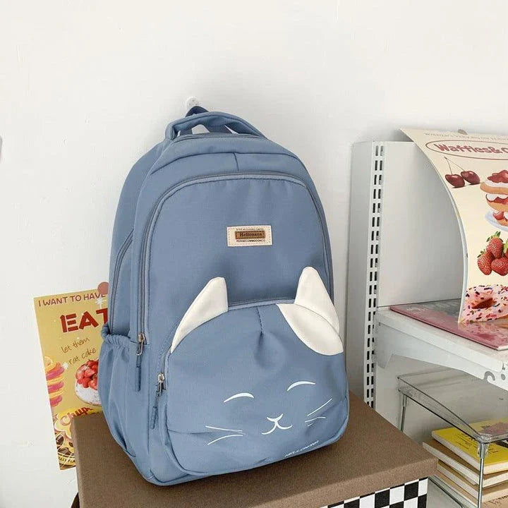 A stylish Japanese-inspired cat backpack with a large capacity, breathable nylon construction, and dedicated storage compartments for student essentials.