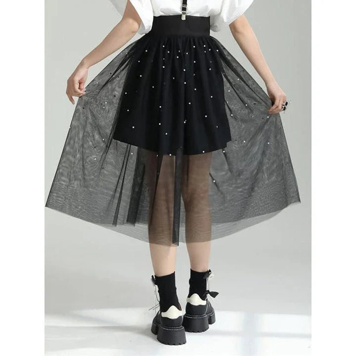 Stylish Dot Mesh Midi Skirt in black, featuring an asymmetrical silhouette and delicate dot mesh overlay