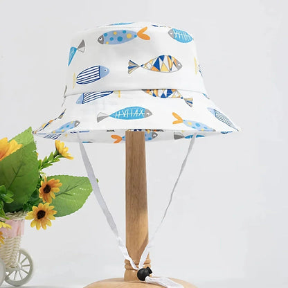 Adorable cartoon-printed cotton baby sun hat with adjustable drawstring for secure fit and wide brim for UV protection