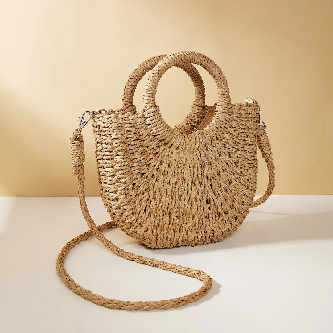 Stylish and eco-friendly straw woven beach bag for Kiwi women, featuring a unique half-moon shape, premium paper straw, and cotton lining.