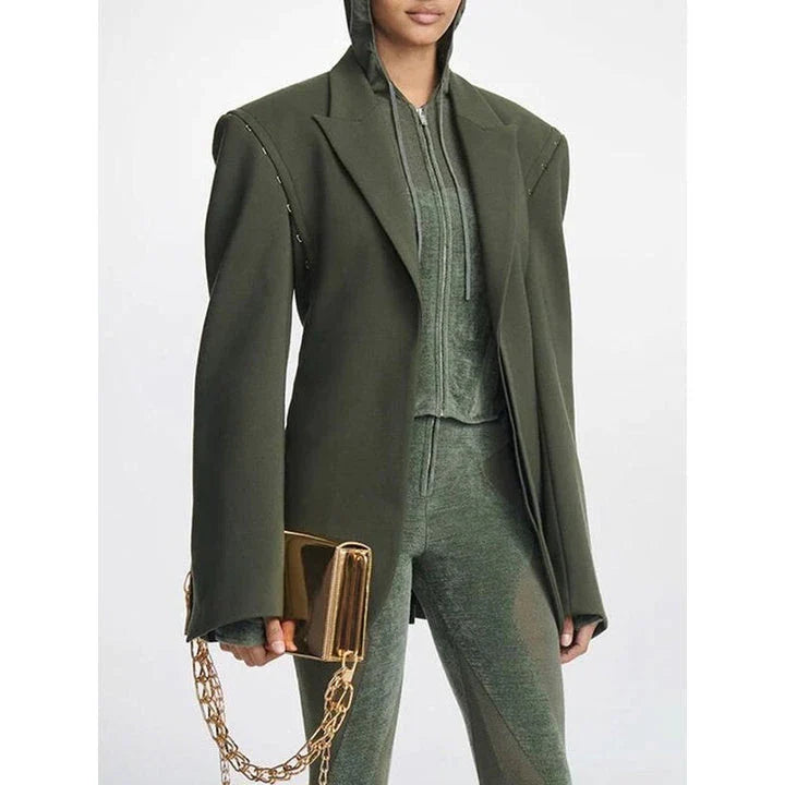 A stylish autumn blazer with a notched metal buckle decoration and camouflage pattern, designed for the modern Kiwi woman