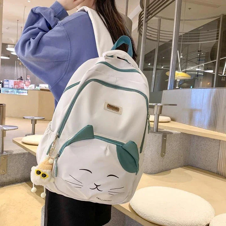 A stylish Japanese-inspired cat backpack with a large capacity, breathable nylon construction, and dedicated storage compartments for student essentials.