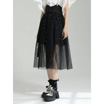 Stylish Dot Mesh Midi Skirt in black, featuring an asymmetrical silhouette and delicate dot mesh overlay