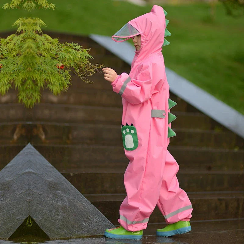 A child wearing a vibrant yellow waterproof raincoat jumpsuit, perfect for playing outdoors in the rain.