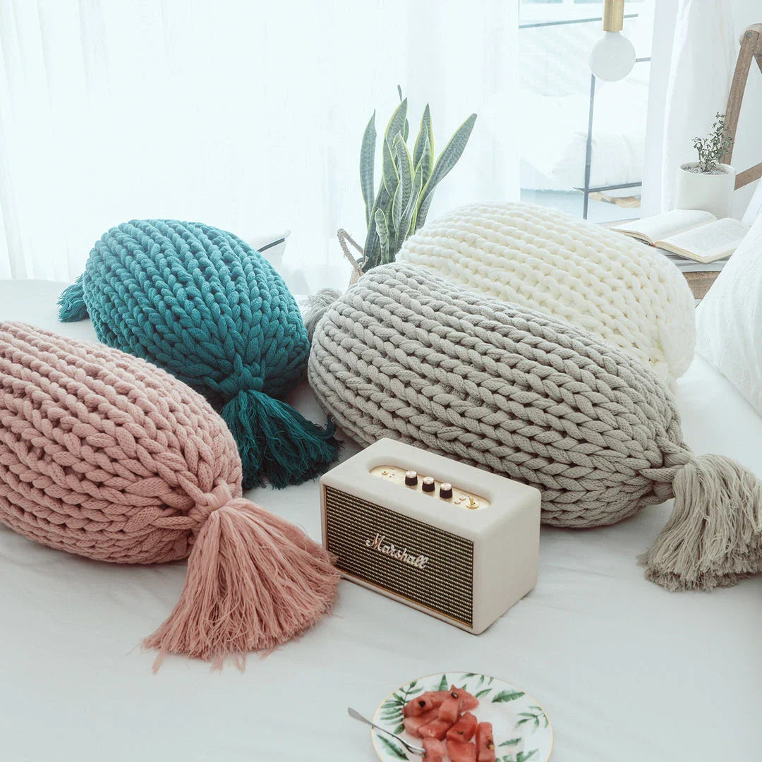 Cosy candy-shaped chunky knit pillow with adorable tassel design, perfect for adding a playful touch to your Kiwi home decor