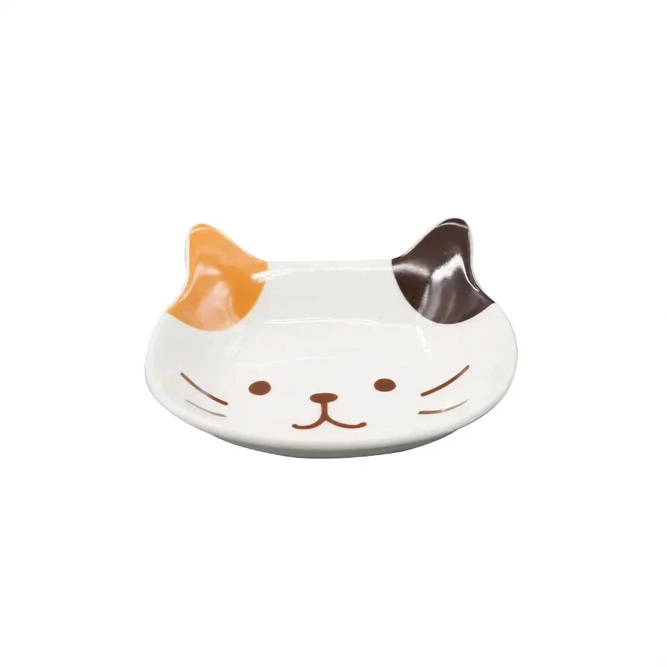 Charming Japanese-style ceramic condiment dish with a playful cat design, perfect for serving sauces, dips, and small snacks.