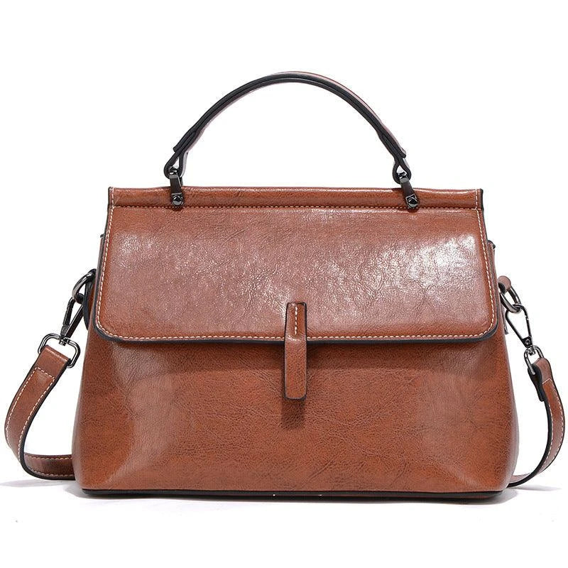 A stylish and spacious leather commuter handbag in a variety of classic colours, featuring a sleek design and practical interior organization to meet the needs of modern Kiwi consumers.