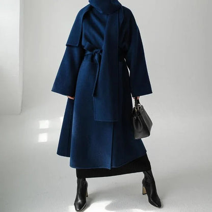 Stylish and warm New Zealand women's woollen coat in blue, featuring a chic scarf collar and relaxed fit design.